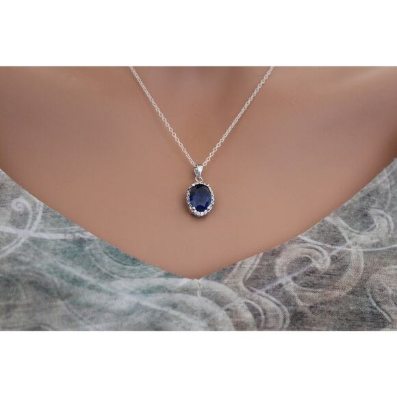 Sterling Silver Blue Oval CZ Pendant Circled in Clear CZ Stones Necklace - Picture 2 of 5